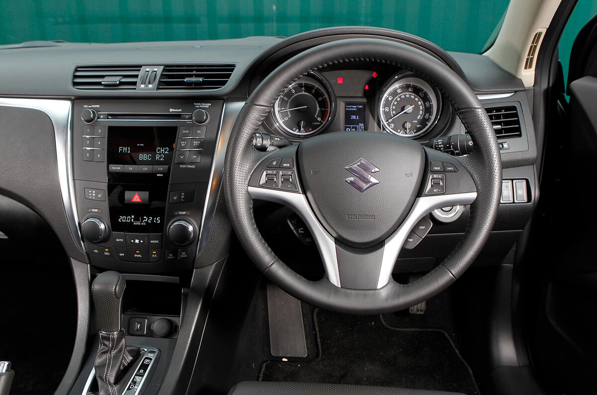 The Kizashi's cabin holds few surprises Suzuki Kizashi dashboard