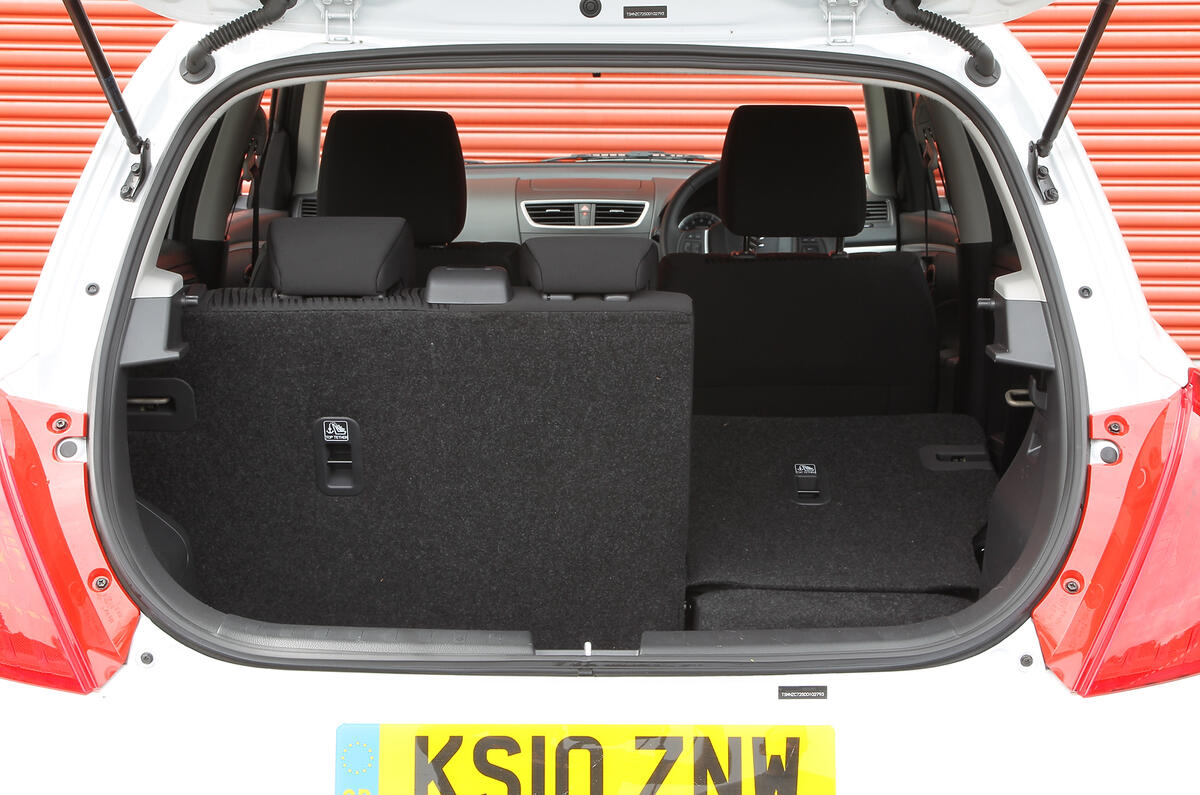 Boot has a meagre 204-litre capacity with rear seats up; there’s quite a lip, too Suzuki Swift boot space