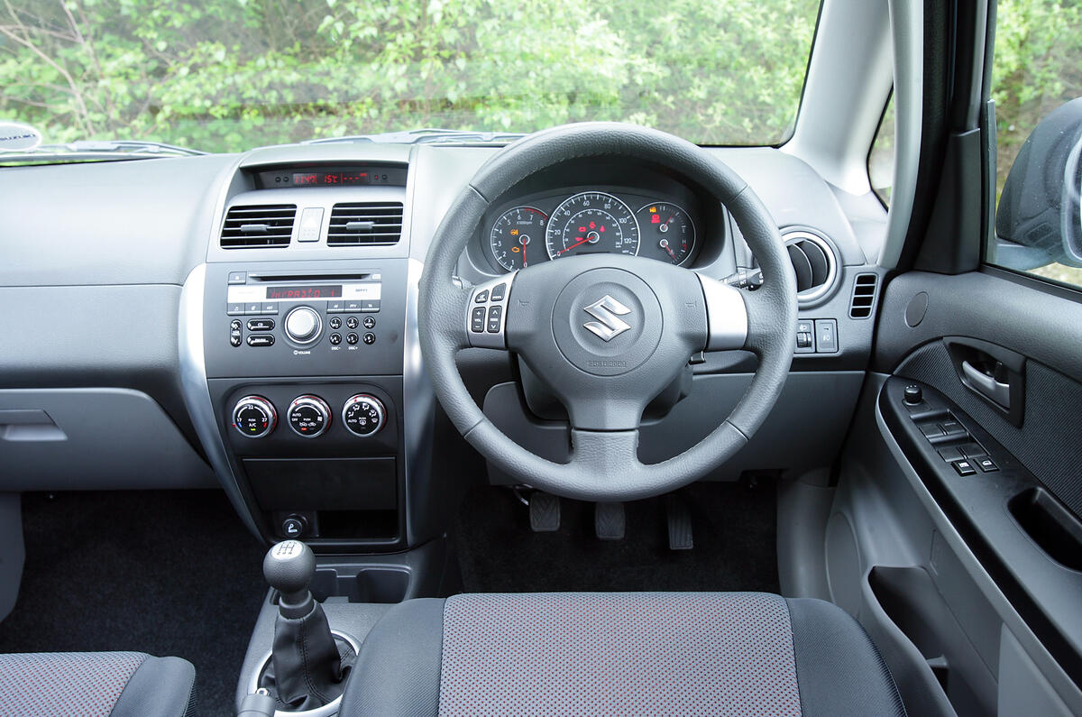 Less is more: simple facia impresses but cheap plastics let down well kitted cabin Suzuki SX4 dashboard