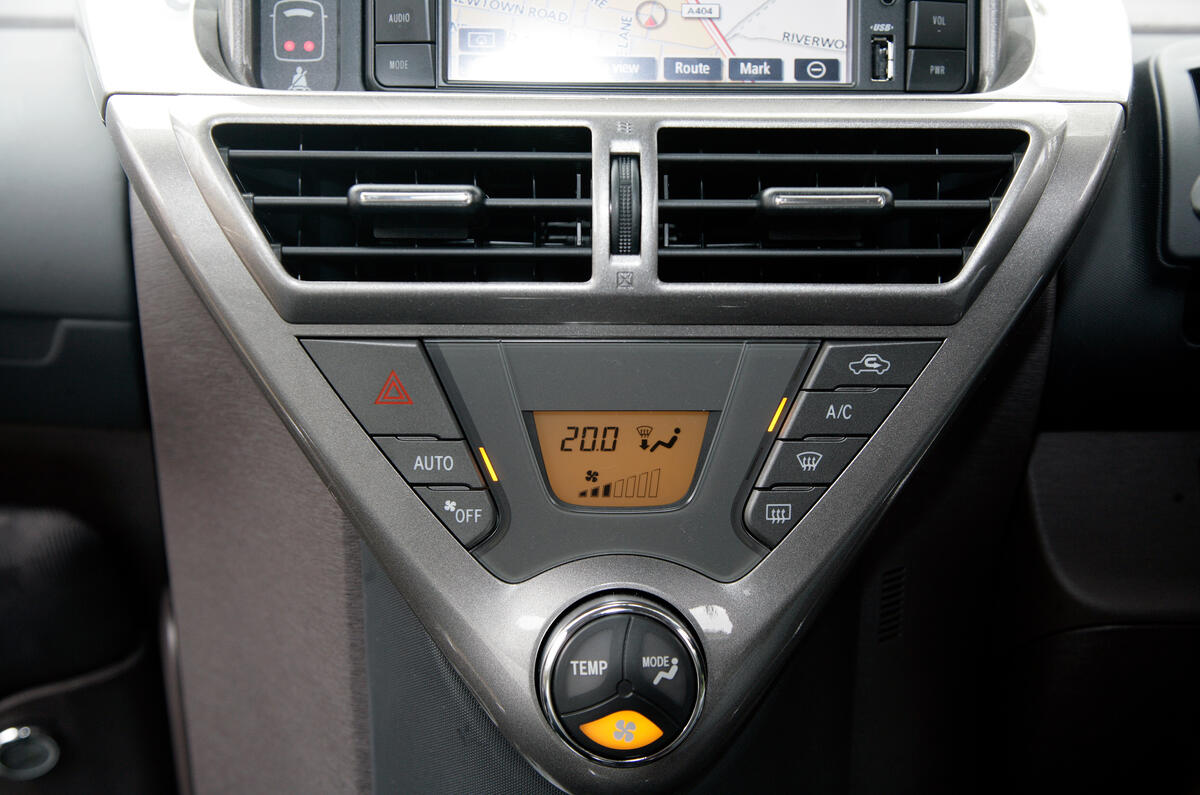 Dashboard design and materials are fully in keeping with the iQ’s pricing point Toyota iQ centre console