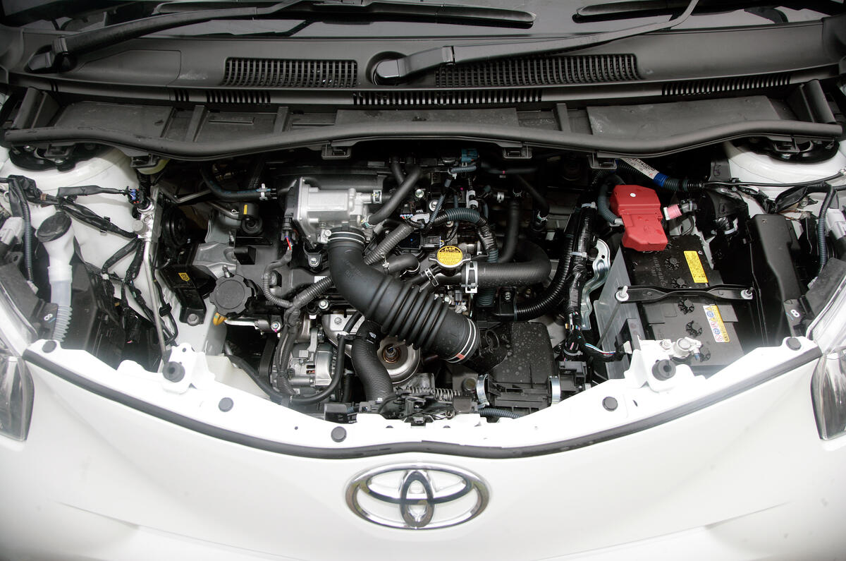 The engine is eager and willing to rev cleanly to its red line Toyota iQ engine bay