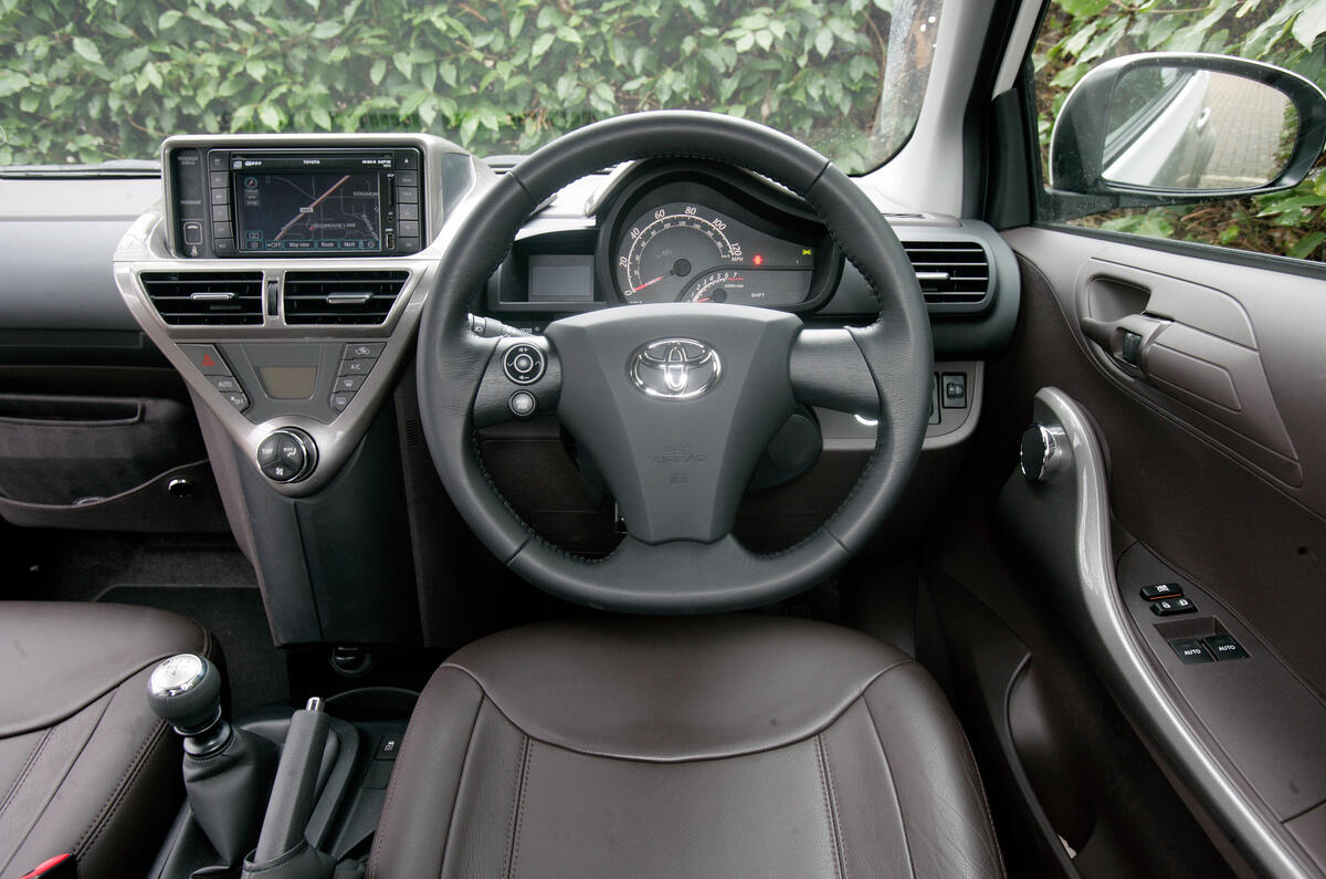 Cabin is more spacious than anticipated due to it's asymmetric design Toyota iQ dashboard