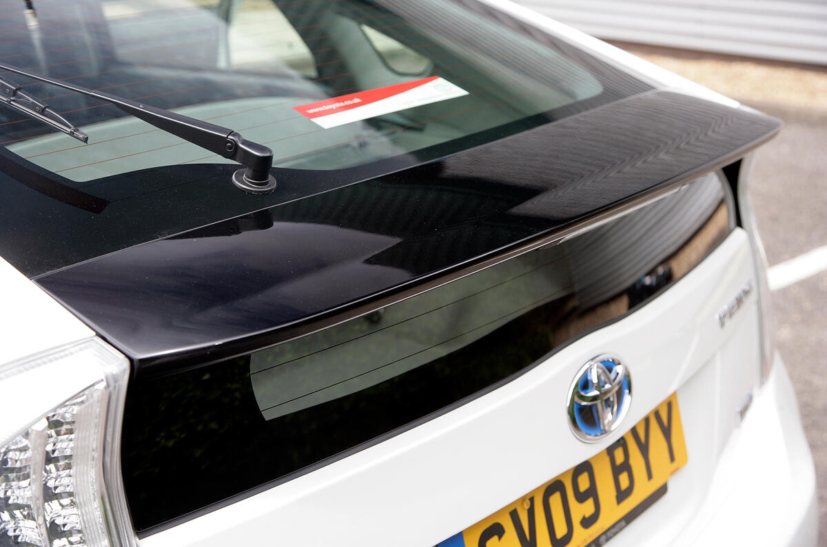 A separate, slender rear window sits under the rear spoiler. Helps with aerodynamics, not visibility Toyota Prius rear spoiler
