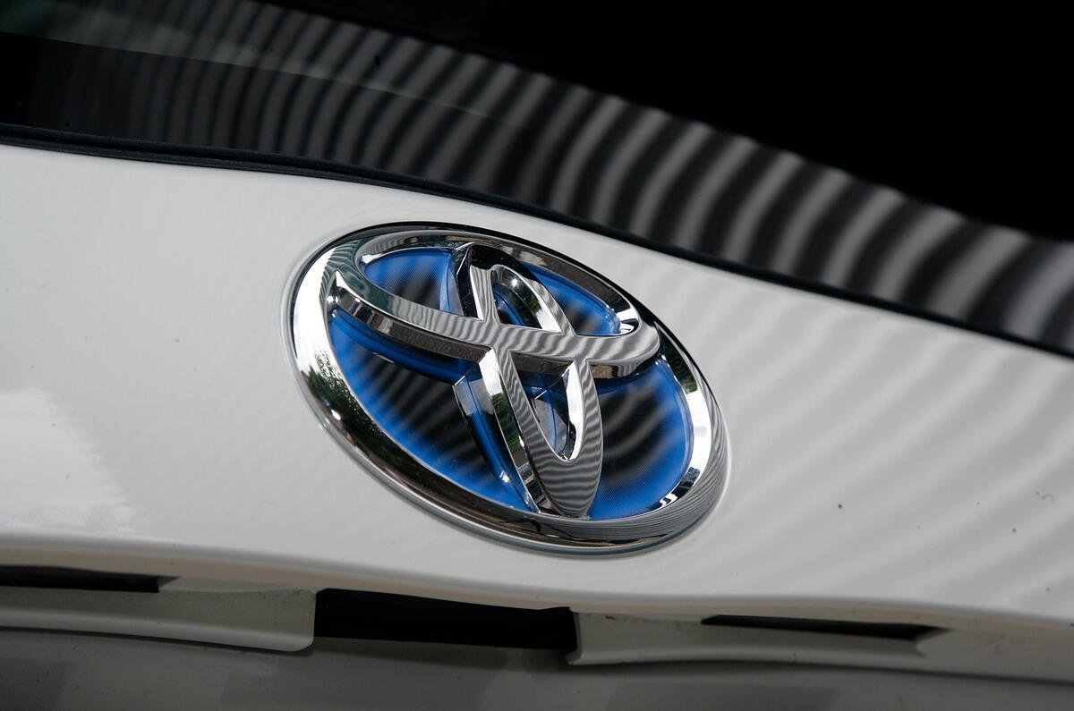 While Toyota doesn't usually stand for cutting-edge designs, the Prius features lots of neat details Toyota hybrid badging