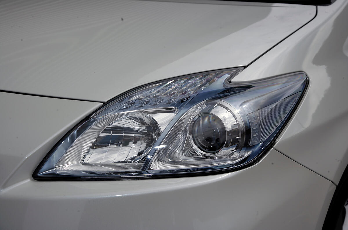 Headlamp surrounds are blue-tinted Toyota Prius headlight