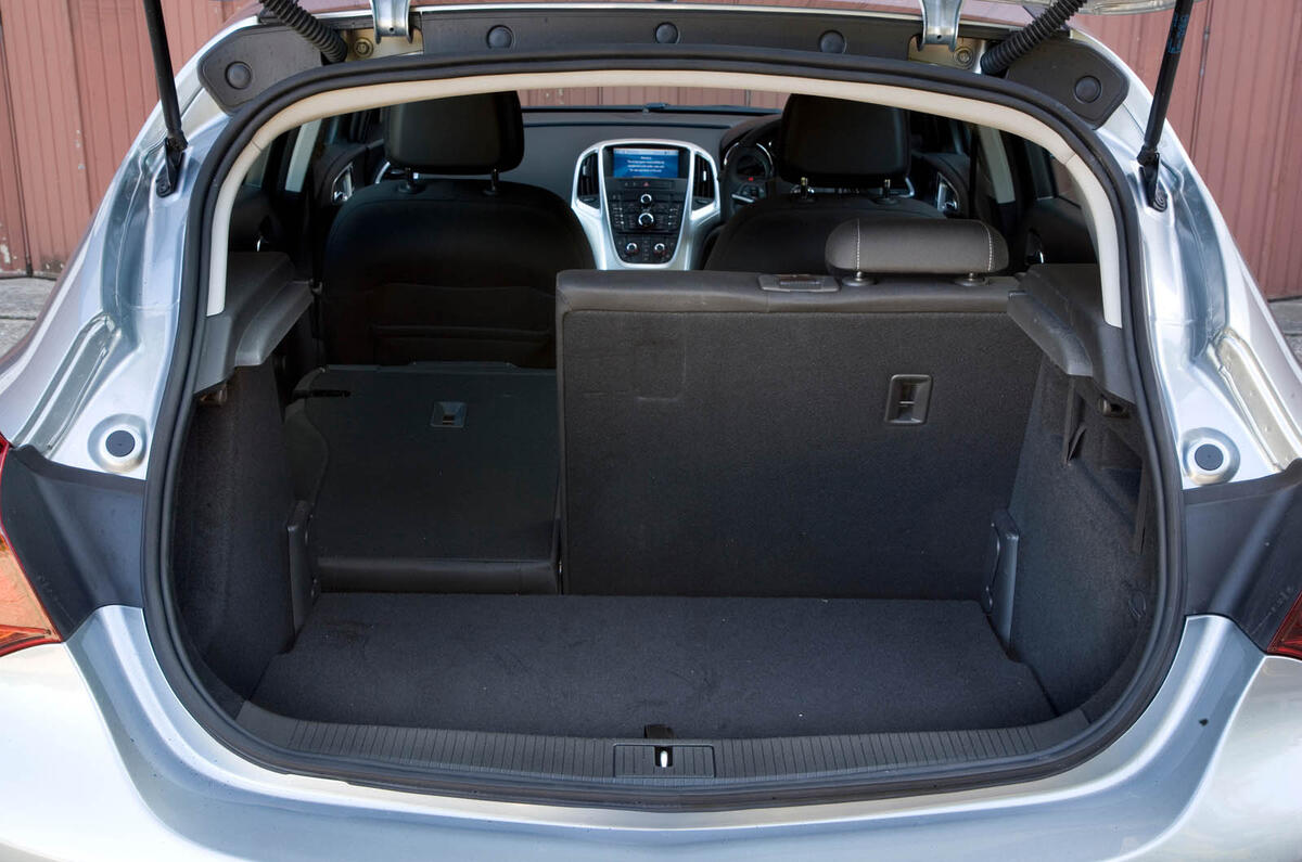 Rakish rear trims boot to a modest 370 litres in the hatchback. Seats folded, it offers 1235 litres Vauxhall Astra boot space