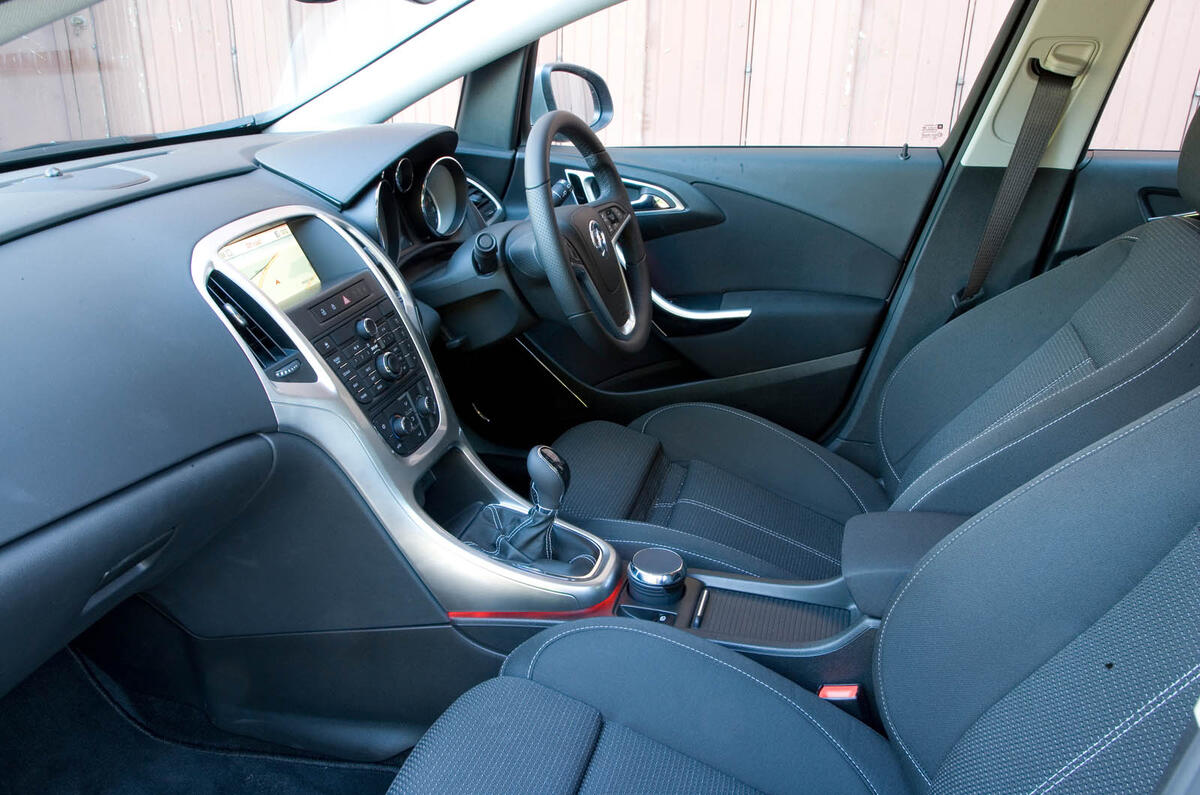 The cabin is a good place to be, with supportive seats, a sense of quality and plenty of room Vauxhall Astra interior