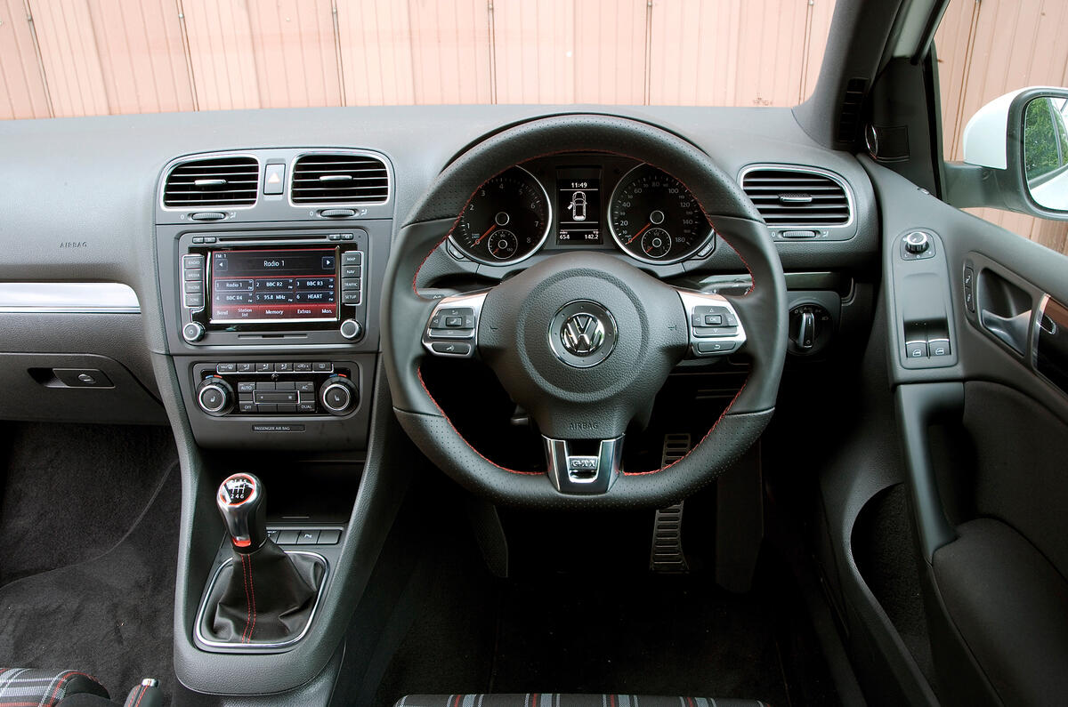 There are enough touches here to leave you in no doubt that this is no normal Golf Volkswagen Golf GTI dashboard