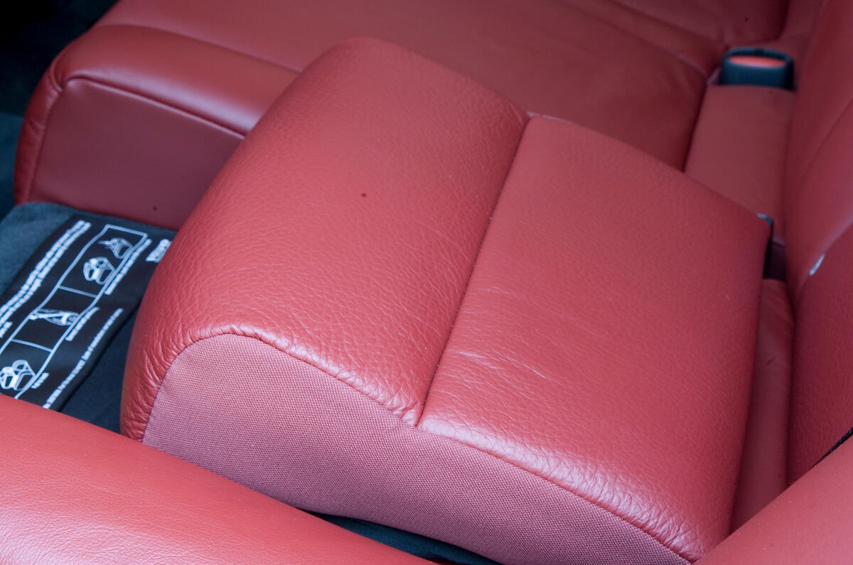 Dual-height child booster seats fold into rear seat Volvo V70 child booster seat
